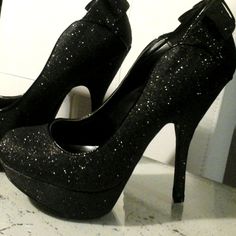 New Pair Of Shoes By Night Moves Black Glitter Sparkle Fabric Upper Trimmed In Fx Patent Leather Covered 5.25 In. Heel With 1.5 In. Toe Platform Accent Double Bow At Heel Rounded Toe Gold Padded Insole Treaded No Slip Toes On Outer Sole Black Platform Heels For Prom, Shimmer Pointed Toe Heels For Night Out, Black 4-inch Heel Heels For Prom, Black 4-inch Heel Prom Heels, Elegant Heels With Glitter Print And Round Toe, Black 4-inch Heels For Prom, Glitter Accented Heels For Night Out And Party Season, Glitter Heels For Night Out And Party Season, Black Glitter Heels For Formal Occasions