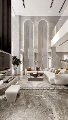 a large living room with marble floors and walls