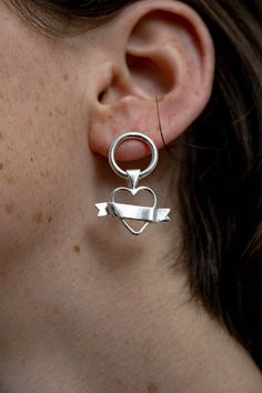 Beautiful & cool statement single open heart earring, inspired by the classic mom heart tattoos.This unique dangle heart earring, which is made of sterling silver, is one of my personal favorites! The combo of the circle with the heart dangling from it is absolutely gorgeous, and makes the perfect statement single earring you we're looking for!✔ Nickel Free✔ Packed in a labeled gift box✔ Hand made with love in Tel Aviv✔ 14 days return policy, starting from date of package delivery to custome Sterling Silver Heart Charm Drop Earrings, Trendy Double Heart Pierced Jewelry, Sterling Silver Single Drop Heart Earring, Single Double Heart Earring In Sterling Silver, Trendy Double Heart Sterling Silver Jewelry, Trendy Sterling Silver Double Heart Jewelry, Personalized Heart-shaped Sterling Silver Earrings, Sterling Silver Heart Pendant For Pierced Ears, Sterling Silver Open Heart Jewelry For Pierced Ears