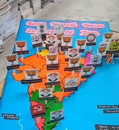 the map of india is made out of paper and has different states on it,