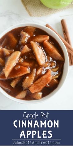 a white bowl filled with cinnamon apples covered in gravy on top of a table