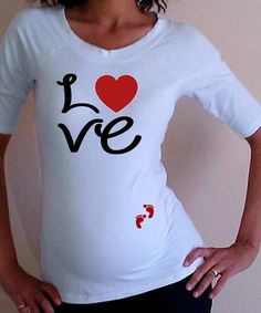 a woman wearing a t - shirt that says if you like it, it's a boy