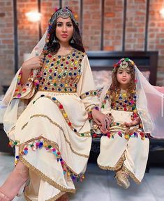 afghan kuchi traditional wedding dree is made of good quality long lasting fabric. Traditionally such Afghanistan Persian Pashtun new design frocks are used as bridal dress. Most of girls also like and recommend such dresses for wedding, Nikkah and Mehndi night events. The dress measurements are kept average. If you need this frock in exact measurements you need, then please send us measurements which best fit on your body Bohemian Dabka Lehenga For Eid, Bohemian Lehenga With Dabka For Eid, Multicolor Kaftan With Dupatta For Wedding, Bohemian Wedding Lehenga With Dabka, Bohemian Wedding Lehenga With Dabka Detailing, Bohemian Salwar Kameez With Mirror Work For Wedding, Bohemian Wedding Salwar Kameez With Mirror Work, Bohemian Sharara For Eid And Traditional Ceremonies, Bohemian Wedding Dupatta With Dabka Work