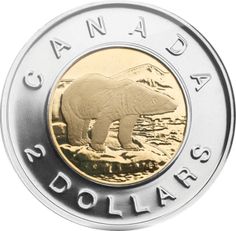 the canadian $ 1 coin is shown in gold and silver, with an image of a polar bear