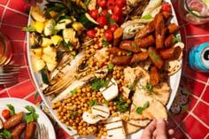 a platter filled with grilled vegetables and meats