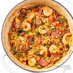 a large pot filled with shrimp and rice