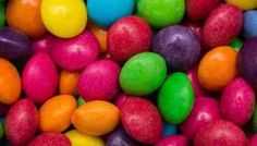 many different colored candies in a pile