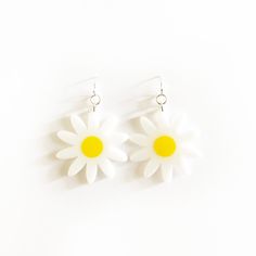 "x WHITE AND YELLOW DAISY EARRINGS x White and yellow daisy earrings with silver earring hooks.  x All acrylic is 1/8\" thick x Silver earring hooks x Please allow 5-7 business days for make + shipping." Trendy White Flower-shaped Earrings, White Flower-shaped Trendy Earrings, Spring Hypoallergenic White Jewelry, Hypoallergenic White Jewelry For Spring, White Flower Drop Earrings For Summer, Cute White Summer Jewelry, Handmade White Daisy Earrings, Handmade Daisy White Earrings, White Daisy-shaped Jewelry For Spring