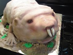 a cake shaped to look like an animal with its mouth open