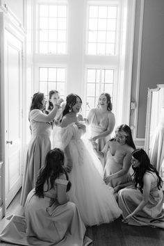 a group of women standing around each other