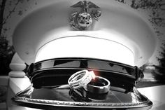 two wedding rings sitting on top of a silver tray