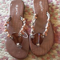 These Cute Sandals Are Made By Just Be Brown And Tan Size 6 New Without Tags Brown Synthetic Flip Flops For Vacation, Brown Open Toe Flip Flops For Beach Season, Brown Synthetic Flip Flops For Summer, Brown Synthetic Flip Flops For Beach, Brown Toe Post Sandals For The Beach, Brown Synthetic Summer Flip Flops, Adjustable Brown Flip Flops For Beach, Brown Flat Sandals For The Beach, Adjustable Brown Sandals For Beach Season