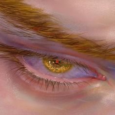 the eye of a person with yellow eyeshadow and long hair on their face