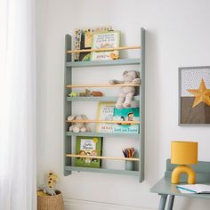 a child's room with bookshelves and toys on the shelves in it