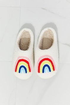 Rainbow Plush Cozy Slippers Part of The Kindness Collection. $2 from every item sold is donated to our featured nonprofit. Click here for our current Kindness Collection nonprofit partner information. Start off your day the perfect way, with these rainbow-graphic slippers (and a cup of coffee), or give the gift of comfort and support to those in need. Soft and fuzzy on the inside and the outside, these slippers will keep you warm and cozy whether you're working from home or getting ready for a g Rainbow Plush, Faux Fur Top, Rainbow Graphic, Fur Top, Comfy Slippers, Slippers Cozy, Teddy Bear Plush, High Quality Shoes, A Cup Of Coffee