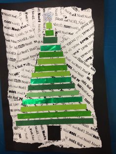 a christmas tree made out of strips of paper on a piece of black and white paper