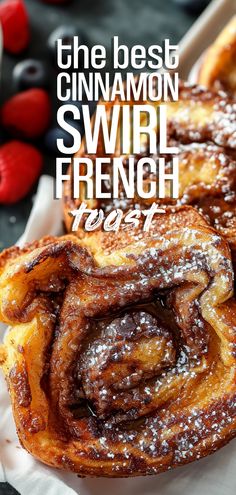 the best cinnamon swirl french toast with fresh berries in the background and text overlay