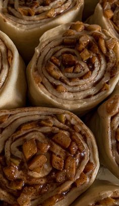 several cinnamon rolls are stacked on top of each other