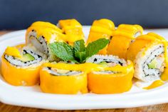 sushi rolls are arranged on a white plate