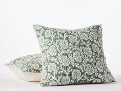 two pillows sitting on top of each other