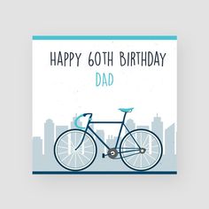 a birthday card with a bicycle on the front and cityscape in the background