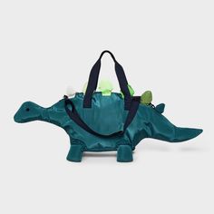 The Kids' Dinosaur Duffel Bag by Cat & Jack™ Green is perfect for young adventurers with a love for dinosaurs. With a sturdy zip closure, the main compartment ensures belongings stay secure. The adjustable strap and double handles provide versatile carrying options, making it a travel-ready companion for your little one. Ideal for young explorers, this durable dinosaur duffel bag from Cat & Jack combines style and functionality seamlessly. Cat & Jack™: Kids’ clothing with an imagination of its o Dinosaur Bag, Cat Bags, Backpack Art, Jack Green, Unique Backpacks, Pocket Pet, Personalized Gifts For Kids, Cat And Jack, Dinosaur Kids