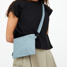 This lightweight and functional bag is constructed with 100% recycled plastic bottles, making it a sustainable crossbody. The versatile and practical features, alongside it being super lightweight and packable makes this bag a classic to be worn every day. It features a clip-fastened strap, allowing it to be carried as a clutch or used to keep items organized within your bag. Shell material: Recycled polyester from PET-bottles with durable, Water-resistant and TPE coating   Lining material: Water Resistant RPET 600D  Wash cold, line dry. Pet Bottle, Recycle Plastic Bottles, Independent Designers Fashion, Badger, Recycled Plastic, Plastic Bottles, Designer Fashion, Arizona, Every Day