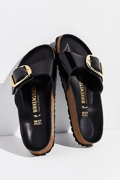 The classic single-strap sandal by Birkenstock\t\t\t\t\t\t\t\t\t\t\t\t\t\t\t\t\t\t\t\t\t\t\t\t\t now featured in a shiny patent leather with oversized buckle detailing, a comfy molded footbed, and durable EVA outsole. * Open-toe style* Adjustable buckle * Anatomically shaped cork-latex footbed**Fit:** Narrow: A-B Width. A Birkenstock narrow width fit is comparable to a Medium (B Width). Madrid Big Buckle, Birkenstock Madrid Big Buckle, Black Birkenstock, Buckle Outfits, Fashion Shoes Sandals, Shoes Outfit Fashion, Fancy Shoes, Footbed Sandals, Birkenstock Madrid