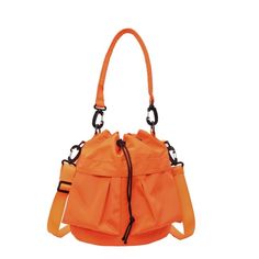 Multi-Pocket Drawstring Bucket Bag Width Height Thickness Handle Length 24 24 14 26 measurement is cm.Product Information Material: 100% Nylon Color: Black Wash care: Hand Wash, Wipe Clean Multi Pocket Bag, Utility Bag, Drawstring Bucket Bag, Orange Bag, Hand Bags, Trendy Fashion Women, Haiti, Ghana, Bucket Bag