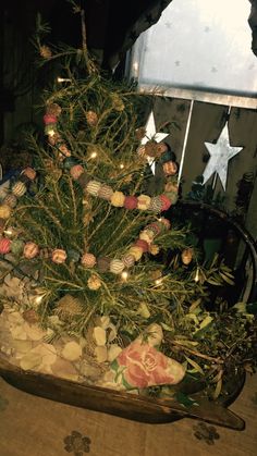 a small christmas tree with ornaments and lights