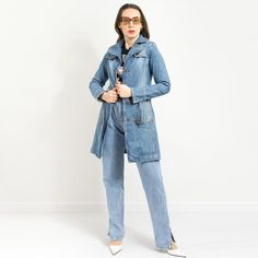 "Vintage women's denim trench in blue - 2 outer pockets - belted - materials: denim SIZE size from label: no label best fits women: S/M MEASUREMENTS bust: 35,5 inches (90 cm) waist: 31 inches (78 cm) hips: 37 inches (94 cm) length: 34 inches (88 cm) sleeve length from the shoulder seam: 25 inches (64 cm) The model is 5'9\" (174 cm), measures 35-27-38 (90-69-96 cm) CONDITION (1-10) - 8 - The coat in good condition. Washed, ready to wear." Denim Jacket With Belted Cuffs, Long Sleeve Denim Jacket With Belted Cuffs, Utility Style Denim Belted Outerwear, Utility Style Belted Denim Outerwear, Utility Style Denim Outerwear With Belt, Utility Denim Outerwear With Belt, Denim Utility Outerwear With Belt, Belted Denim Blue Denim Outerwear, Belted Long Sleeve Denim Jacket