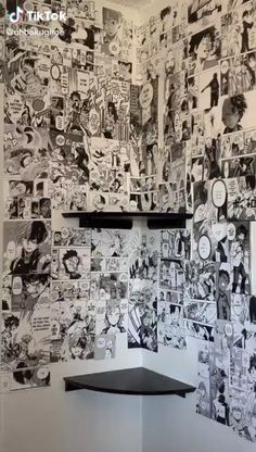 the wall is covered with comic books and comics on it's walls are black and white