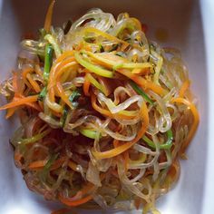 a white bowl filled with assorted veggies