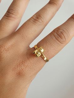 "GUMMY BEAR RING You can get a stylish and cute look with this 90's inspired teddy bear gold plated ring. It can be a gift suggestion that makes you or your loved ones realize the importance of your inner child. YOU MAY ALSO LIKE THESE: https://www.etsy.com/listing/956510530/18k-gold-plated-gummy-teddy-bear-cute https://www.etsy.com/listing/998626958/18k-gold-plated-rabbit-hugging-hands https://www.etsy.com/listing/982521278/18k-gold-plated-butterfly-animal-dainty HOW TO ORDER FROM US ? 1. Click on \"View cart and check out\" 2. At checkout, please fill in your special requests, check if the order is a gift. 3. Choose your shipping method. 4. Enter your payment details and complete purchase. MAINTENANCE OF YOUR JEWELRY - Maintain your jewelry's high shine by avoiding contact with any chemi Teddy Bear Ring, Bear Ring, Style Année 90, Gift Suggestions, Thumb Ring, Gummy Bear, Boho Ring, Cute Rings, Best Friend Gift