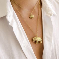 18k Gold plated over sterling silver small elephant charity pendant necklace on 16-18" gold chain. Handcrafted in Bali. Dimensions: Length - 1/2"Width - 5/8" Elephant Necklace Gold, Elephant Charm Necklace, Sheldrick Wildlife Trust, Anna Beck, Bali Jewelry, Small Elephant, Stacked Necklaces, Elephant Necklace, Deep Meaning