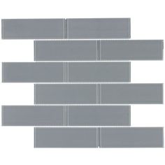 the back side of a gray glass tile wall