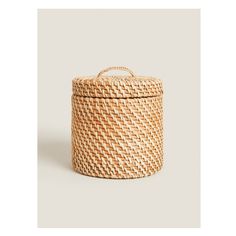 a woven basket with handles on the top and bottom, sitting in front of a white background