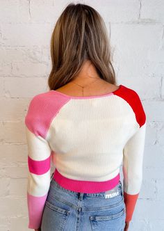 Make a bold style statement with our colorblock stripe sweater, a chic and contemporary piece that effortlessly combines vibrant hues and sleek design for a trendy look. 55% Rayon 45% Nylon Hand Wash Cold Line Dry Model in Red: Meet Brae! Height: 5’7” Hips: 35” Bust:34” Waist: 25” Wearing Size: Small Model in Blue: Meet Katy! Hips: 35" Waist: 26" Bust: 32" Height: 5' 9" Wearing Size: Small Trendy Striped Cropped Sweater, Trendy Striped Stretch Sweater, Sporty Striped Color Block Top, Spring Crew Neck Sweater With Contrast Color, Spring Sweater With Contrast Stripes, Spring Knit Sweater With Contrast Stripes, Knit Sweater With Contrast Stripes For Spring, Striped Color Block Sweater For Winter, Winter Striped Color Block Sweater