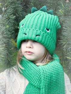 Dino style. The T-Rex Knitted Hat adds a bit of fun to your little one's winter beanie with a green dino face (complete with spikes!). Suitable for ages 3+. Dino Crochet, Cozy Wear, Winter Beanie, Knitted Hat, Age 3, T Rex, Knitted Hats, Crochet Hats, Hats