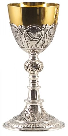 a silver and gold chalice on a white background