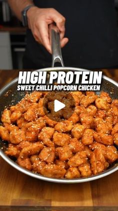 a person is cooking some food in a frying pan with the words high protein sweet chili popcorn chicken