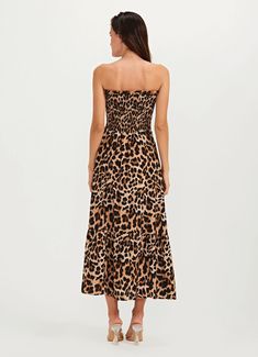 Looking for the perfect beach-to-street outfit? Look no further than our Jaguar Animal Print Dress, the ultimate in versatile style to match with your Brazilian Bikini Featuring a striking animal print design, our dress is perfect for any occasion, from a day at the beach to a night out on the town. The removable sleeves and elastic ruching add a touch of effortless chic to the design, while the lurex threads throughout the fabric add a touch of shimmer and shine. Crafted from high-quality mater Sleeveless Leopard Print Maxi Dress For Vacation, Leopard Print Maxi Dress For Summer Vacation, Strapless Ruched Midi Dress For Beach, Ruched Summer Dress For Beach Cover-up, Leopard Print Maxi Dress For Vacation, Chic Leopard Print Maxi Dress For Vacation, Sleeveless Leopard Print Beach Dresses, Casual Leopard Print Maxi Dress For Beach, Leopard Print Maxi Dress For Beach