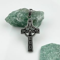 This is a traditional stainless steel Celtic cross necklace for men. This Celtic necklace is a great gift idea for different occasions and a touch of the Irish heritage. Or for yourself if you're looking for something to wear that will last! ----------------------- WHY YOU'LL LOVE IT ----------------------- 💚 Made in Ireland. 💚 Heritage connection: A beautiful representation of Irish culture and tradition. 💚 Durable material: Made from stainless steel, ensuring long-lasting wear. 💚 Great and Engraved Stainless Steel Cross Necklace, Father's Day Stainless Steel Cross Necklace, Gunmetal Cross Necklace Gift, Celtic Cross Necklace, Cross Necklace For Men, Irish Cross, Celtic Necklace, Irish Culture, Irish Jewelry