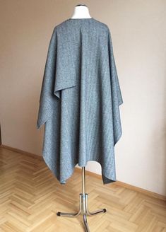 "80% Virgin wool 20% PL Size : Large Oversized Length - shoulder to hem : 100cm/ 39.4\" Width - Across back from armhole to armhole : 145cm / 57\" Care: Dry cleaning Ready to ship I ship internationally registered airmail with tracking number from Lithuania All Ruanas / wraps here https://www.etsy.com/shop/JPalKnits?ref=seller-platform-mcnav&section_id=26910076 I make all my designs in a pet-free and smoke-free environment Thank you for visiting my shop https://www.etsy.com/shop/JPalKnits Wi Oversized Gray Cape For Fall, Oversized Wool Poncho With Long Sleeves, Gray Oversized Poncho For Winter, Oversized Gray Poncho For Winter, Oversized Gray Poncho For Fall, Oversized Wool Shawl Outerwear, Ladies Poncho, Wool Poncho, Wool Shawl