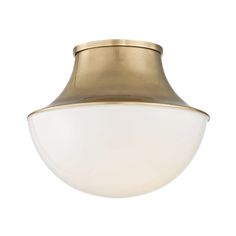 a light fixture with a white glass shade on the top and gold trimmings