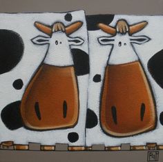 two cows painted on the side of a wall with black and white dots around them