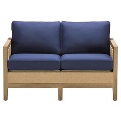 a blue couch with two pillows on it's back and side, in front of a white background