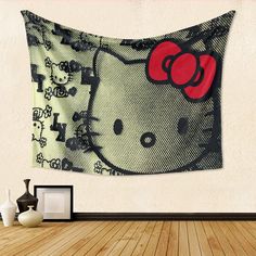 a hello kitty tapestry hanging on the wall