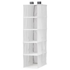 the hanging closet organizer is white and has mesh pockets on each side to keep items organized