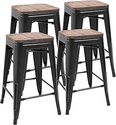 four black metal stools with wood seat cushions